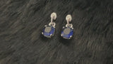 ELODIE - Dangle Sapphire Blue Cushion Earrings In Silver