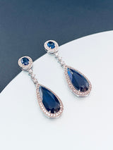 THEODORA - Sapphire Blue Long Dangle Teardrop CZ Crystal Earrings In Silver - JohnnyB Jewelry