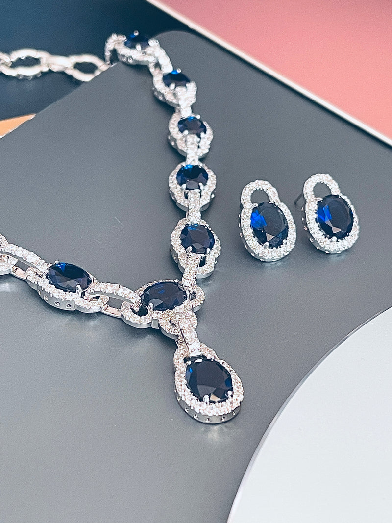 MICHELLE - 17" Oval Sapphire Blue CZ Stone With Matching Stud Earrings In Silver - JohnnyB Jewelry