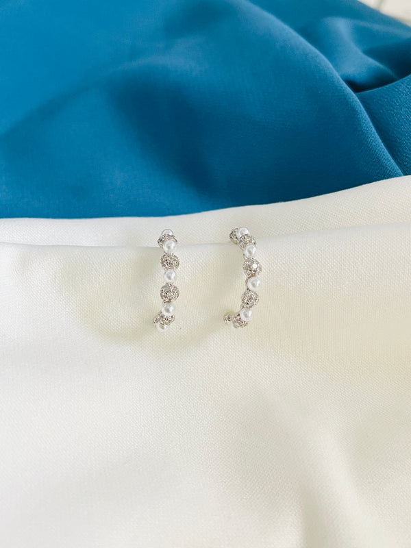 ARIA - CZ Pave Rotate With Pearl Huggie Earrings In Silver