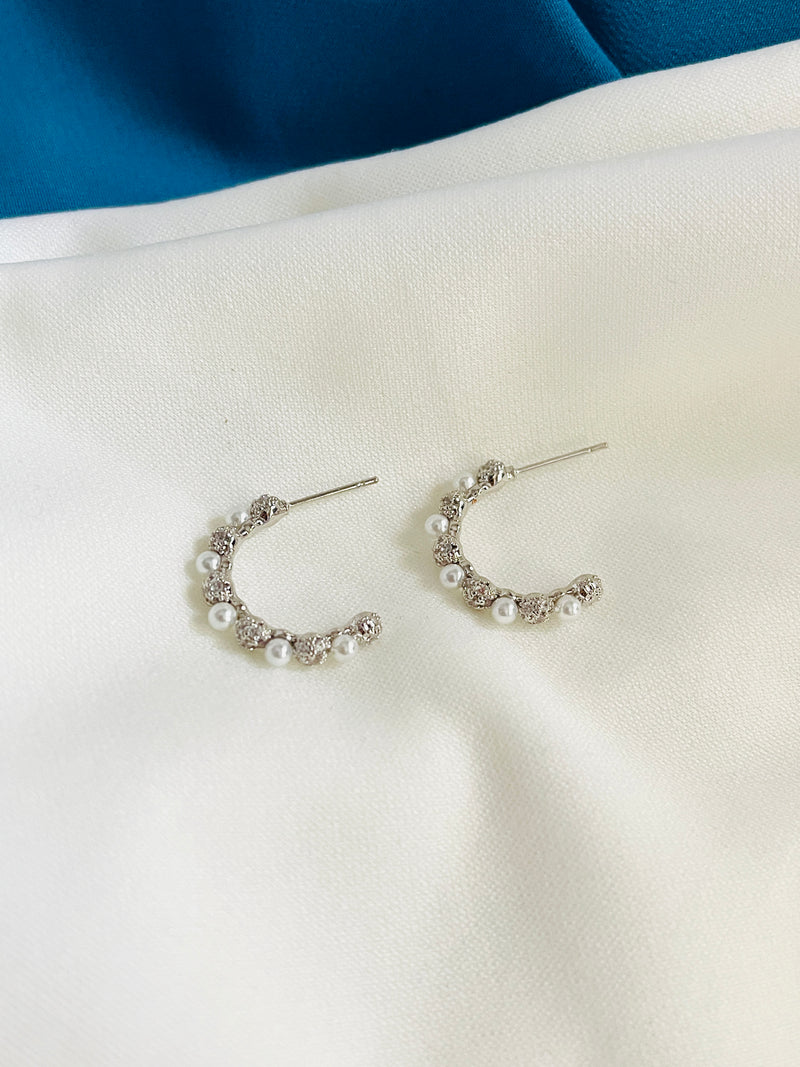 ARIA - CZ Pave Rotate With Pearl Huggie Earrings In Silver