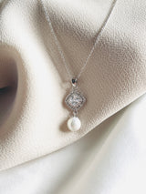 EVELYNE - Graceful CZ Medallion And Pearl Necklace In Silver